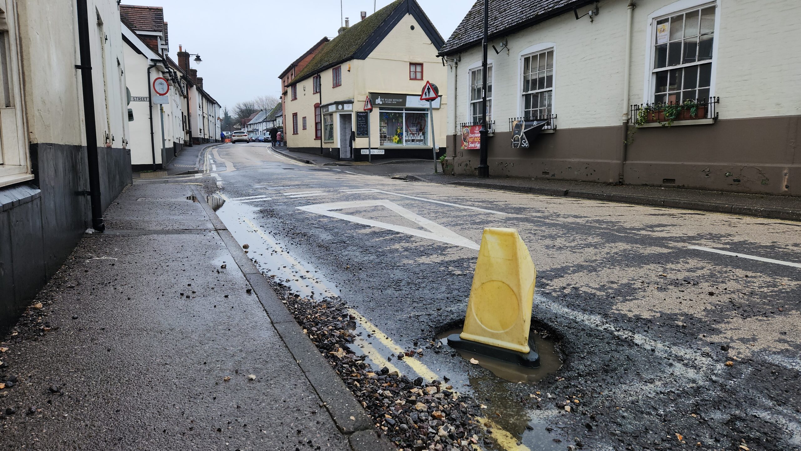 POTHOLES: Overton High Street 'laid with Swiss Cheese'
